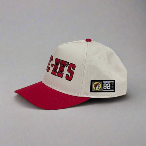Buc-ee's Baseball Cap. White with red brim. 82' is on the side.