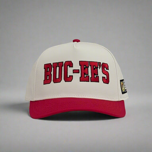 Buc-ee's Baseball Hat. Red brim with white top and the word "Buc-ee's" in red front on the front in bold lettering.