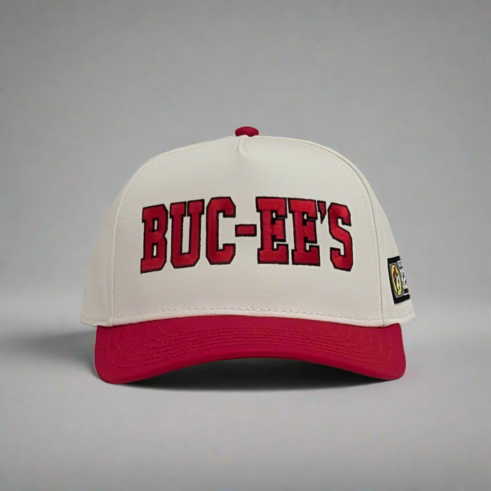 Buc-ee's Baseball Hat. Red brim with white top and the word "Buc-ee's" in red front on the front in bold lettering.