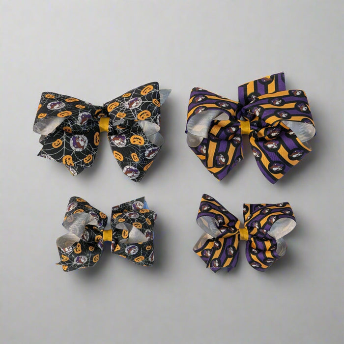 Buc-ee's Halloween Hair Bows. 2 different designs. Spiderweb and Jack-o-lantern and purple and orange stripes.