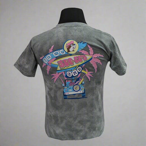 Buc-ee's "In My Era" Shirt. Gray tye die with pink palm trees and "Buc-ee's in My Era" on the back with the truck bed.