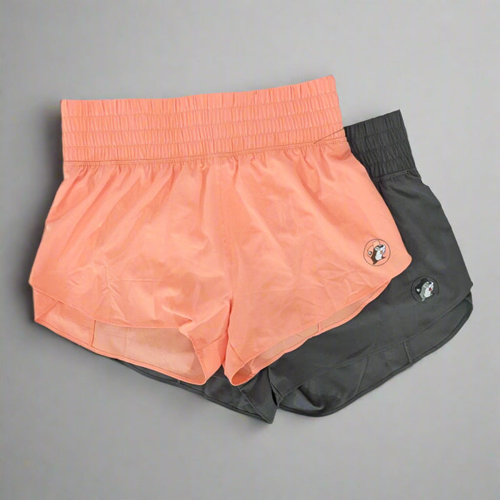 Buc-ee's Performance Shorts. Comes in a black and orange color with the Buc-ee's logo on the bottom corner of the shorts.