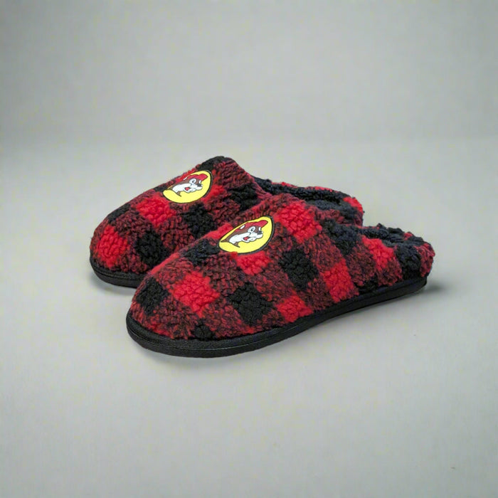 Pair of Buc-ee’s Plaid Sherpa Slippers featuring a red and black buffalo check pattern, soft sherpa lining, and Buc-ee’s beaver logo on the front.