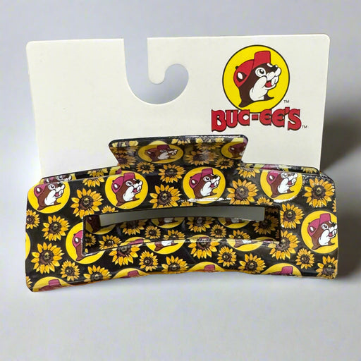 Buc-ee’s hair claw clip featuring a sunflower and Buc-ee’s logo pattern, displayed on a white background.