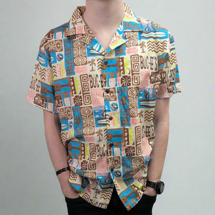 Buc-ee's Tiki Camper Shirt. Button down Tiki style with brown, blue, and peach coloring and designs.