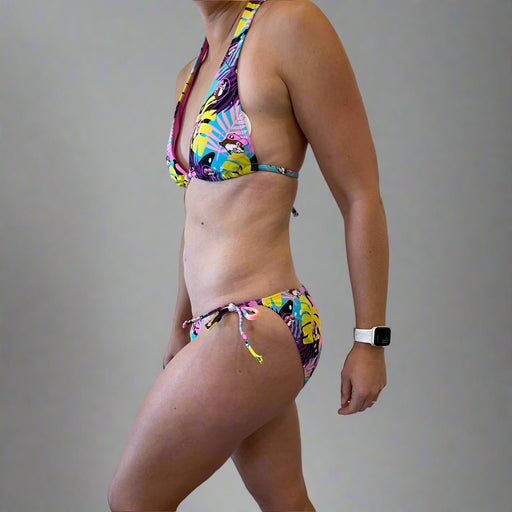 Buc-ee's Tropical Bikini has palm trees print all over in yellow, pink, and purple colors