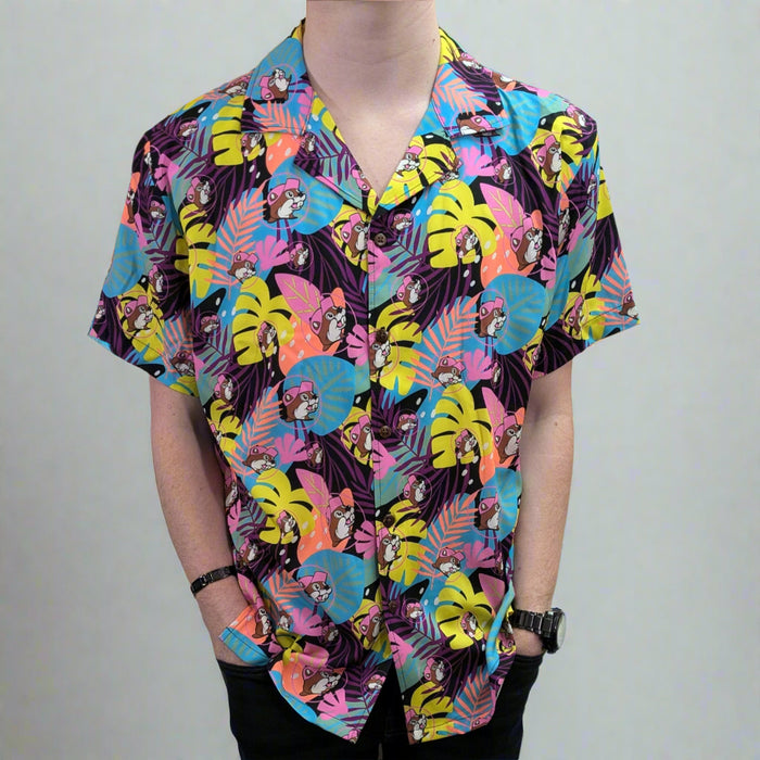 Buc-ee's Tropical Camper Shirt. Has bold purple, yellow, pink palm leaves with Buc-ee all over also.
