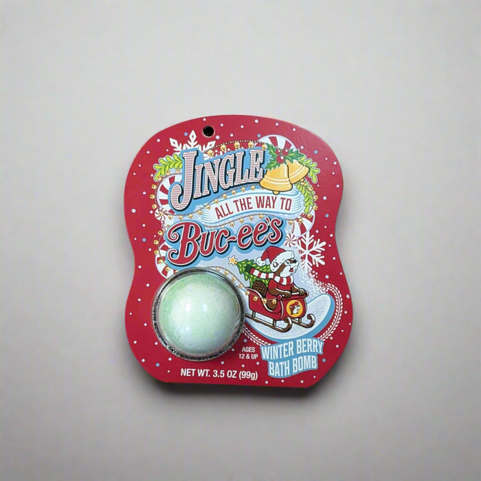 Buc-ee’s Christmas “Winter Berry” bath bomb in red packaging with Santa Buc-ee riding in a sleigh and snowflake decorations.