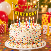 Frosted sprinkle birthday cake with lit candles and the Buc-ee's Happy Birthday topper