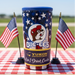 Buc-ee's branded tumbler with American flags on a checkered tablecloth.