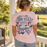 Woman on a porch showing the back of the pink Buc-ee's Makes Me Happy shirt