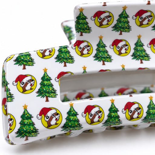Close-up of the white Buc-ee's Christmas claw clip with trees and Santa Buc-ee print
