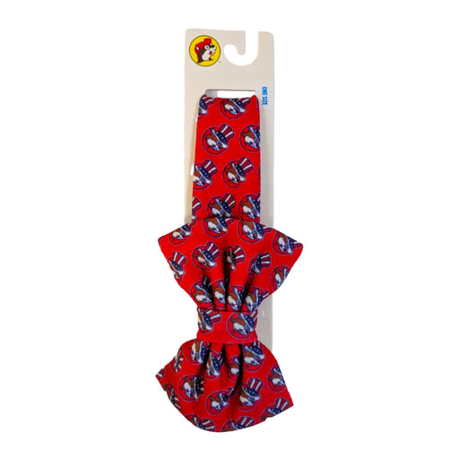 Red Buc-ee's 4th of July headband with large bow on a Buc-ee's display card, on white