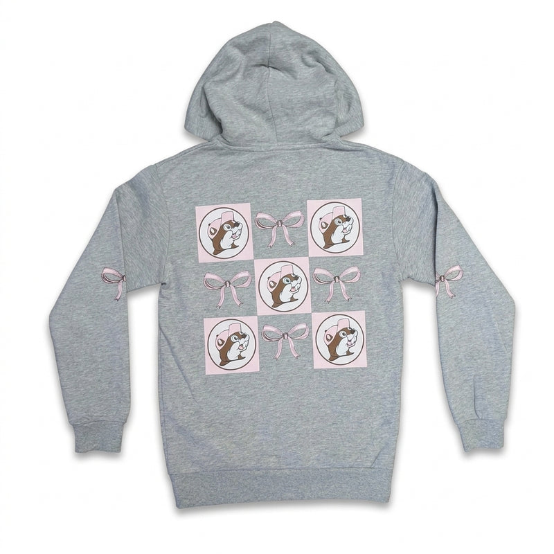 Back view of an adult heather gray Buc-ee's pullover hoodie featuring a 3x3 grid pattern with pink-hatted Buc-ee beaver logos alternating with tied pink bows, flanked by pink bows on the sleeves.
