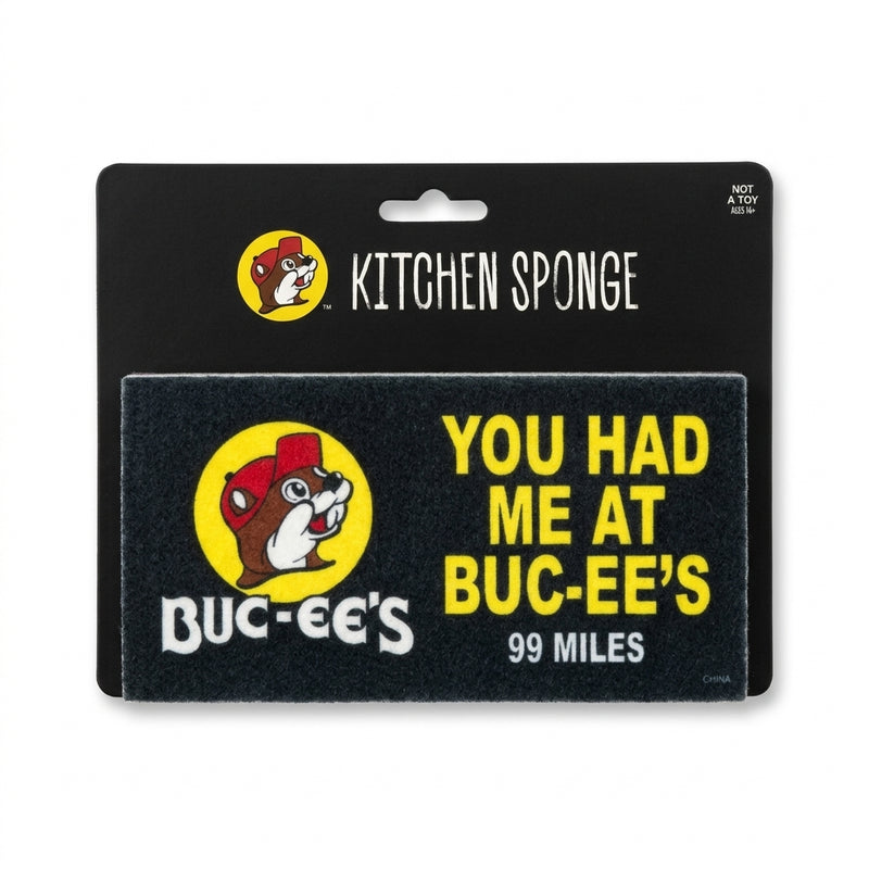 Buc-ee’s rectangular billboard-style kitchen sponge with the words "You Had Me At Buc-ee's 99 Miles" on a black display card.
