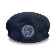 Back view of a navy blue textured knit flat cap displaying a round embroidered Buc-ee's beaver logo patch centered near the hem.