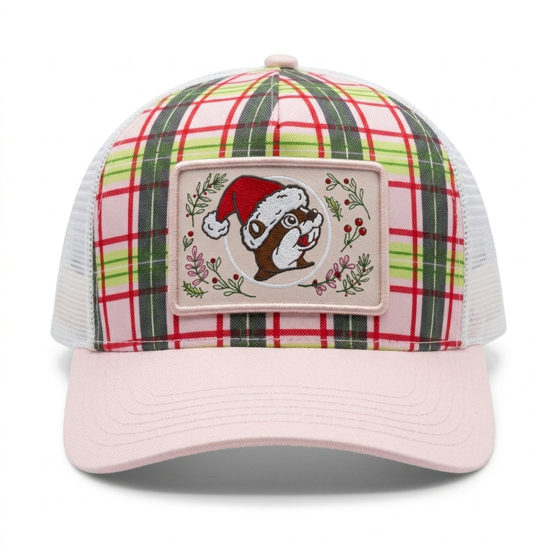 Buc-ee's Christmas trucker hat featuring a pink and green plaid front panel, soft pink bill, white mesh back, and a center patch of Buc-ee the Beaver wearing a Santa hat.