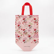 Light pink Buc-ee's tote bag displaying a repeating pattern of Santa Buc-ee surrounded by winter greenery, red berries, and bows.