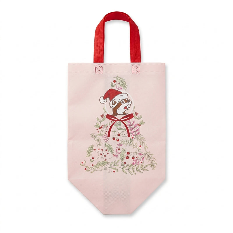 Soft pink Buc-ee's reusable tote bag with red handles featuring a botanical Christmas tree graphic topped with Buc-ee the Beaver in a Santa hat.