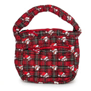 Flat lay of a quilted red and green plaid puffer tote bag featuring an all-over Santa Buc-ee print, padded shoulder strap, and an exterior zippered front pocket.