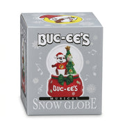 Buc-ee's Musical Snow Globe packaging displaying a glass globe with Buc-ee the Beaver wearing a Santa hat next to a Christmas tree on a red peppermint-adorned base.