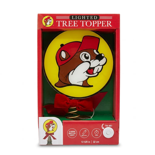 Official Buc-ee's Lighted Christmas Tree Topper in red box packaging showing the circular yellow Buc-ee's logo sign with a red bow and spiral tree attachment.