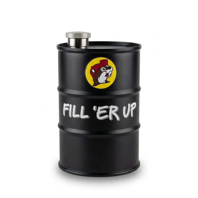 A matte black stainless steel 25oz flask shaped like an oil barrel, featuring the yellow Buc-ee's beaver logo and white text reading "FILL 'ER UP".
