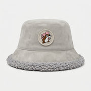 Buc-ee's light gray faux-suede bucket hat with a fuzzy light gray sherpa interior lining and brim trim, featuring a circular front patch of Buc-ee the Beaver wearing a pink cap.
