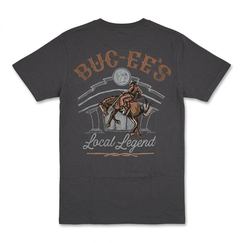 Back of a dark gray Buc-ee's t-shirt featuring a Western graphic of a cowboy riding a bucking horse with "Buc-ee's Local Legend" text.