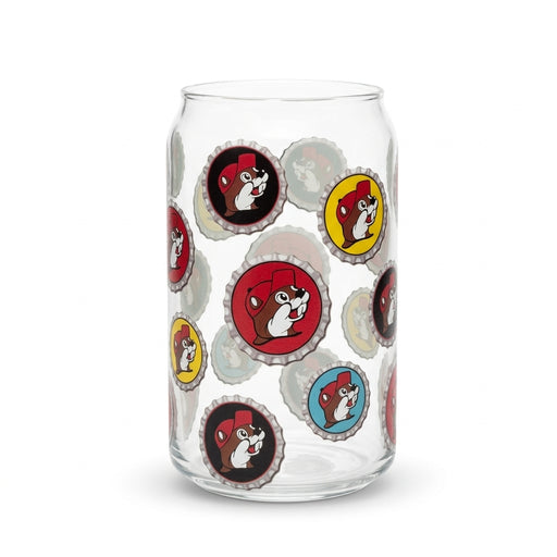 A clear 12oz can-shaped drinking glass covered in an all-over floating pattern of red, yellow, black, and light blue bottle caps, each featuring the Buc-ee's beaver mascot.