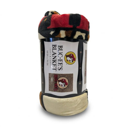 Rolled-up Buc-ee's soft and comfy 50 in x 70 in throw blanket with a leopard print and red plaid pattern, featuring the Buc-ee's beaver logo packaging.