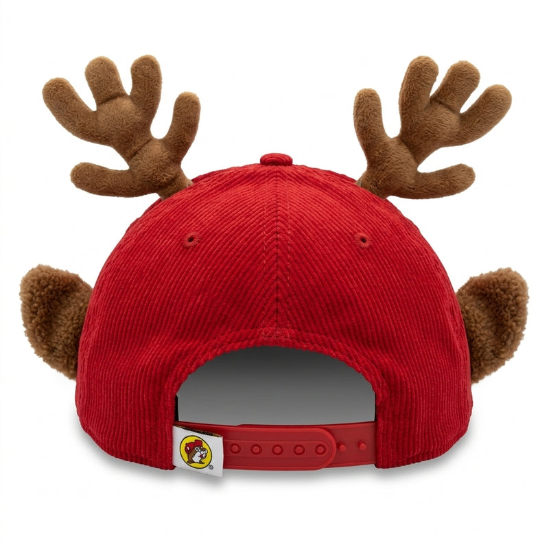 Back view of a red corduroy baseball cap with 3D plush reindeer antlers and ears, showing the adjustable red plastic snapback strap and hanging loop tag.