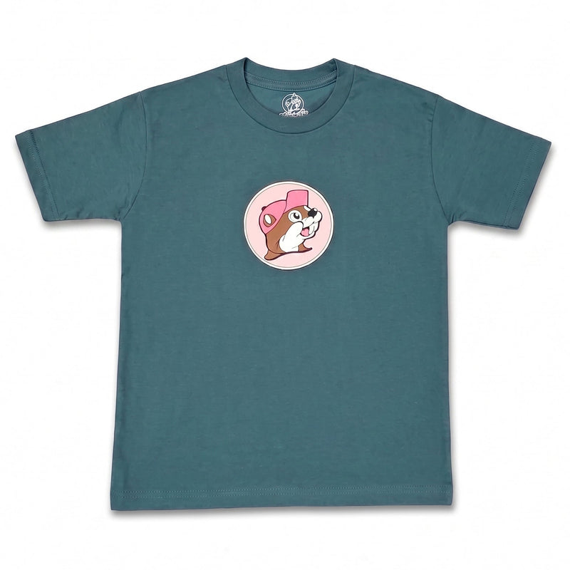 A teal blue short-sleeve t-shirt with a circular graphic on the chest showing a cartoon Buc-ee logo wearing a pink hat, displayed flat against a white background.