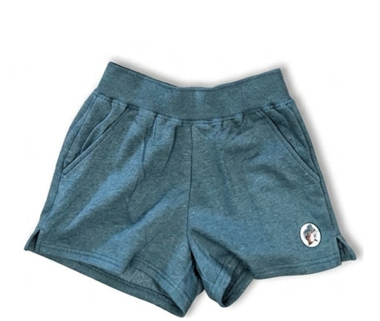 A pair of heathered teal blue athletic shorts with a wide elastic waistband and side pockets, featuring a small circular logo patch on the lower left leg, shown against a plain white background.