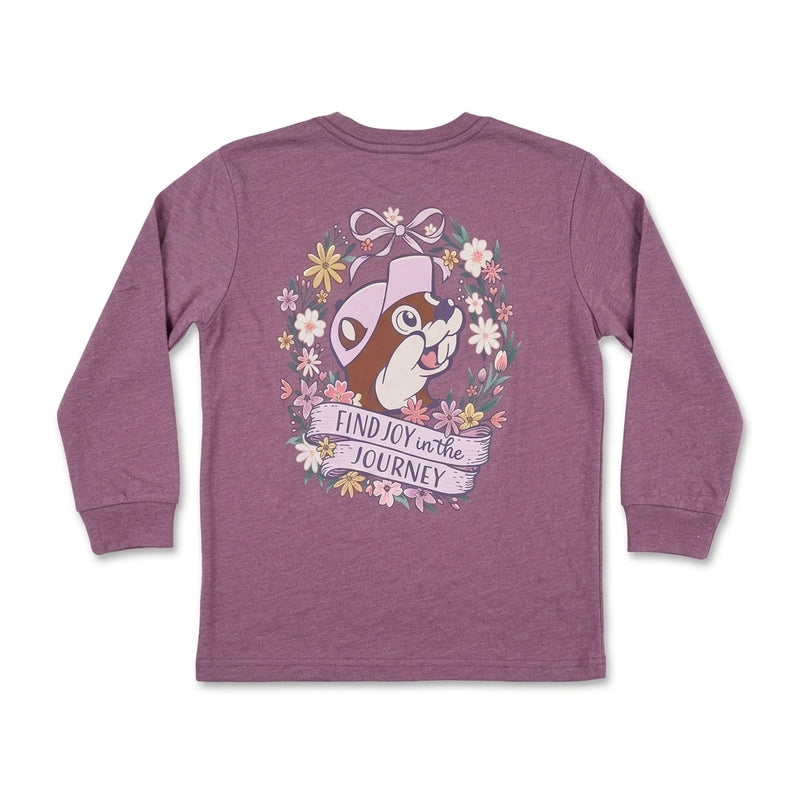 Back view of a youth heather purple long-sleeve T-shirt featuring a large back graphic of Buc-ee inside a floral wreath with a banner reading "FIND JOY in the JOURNEY".