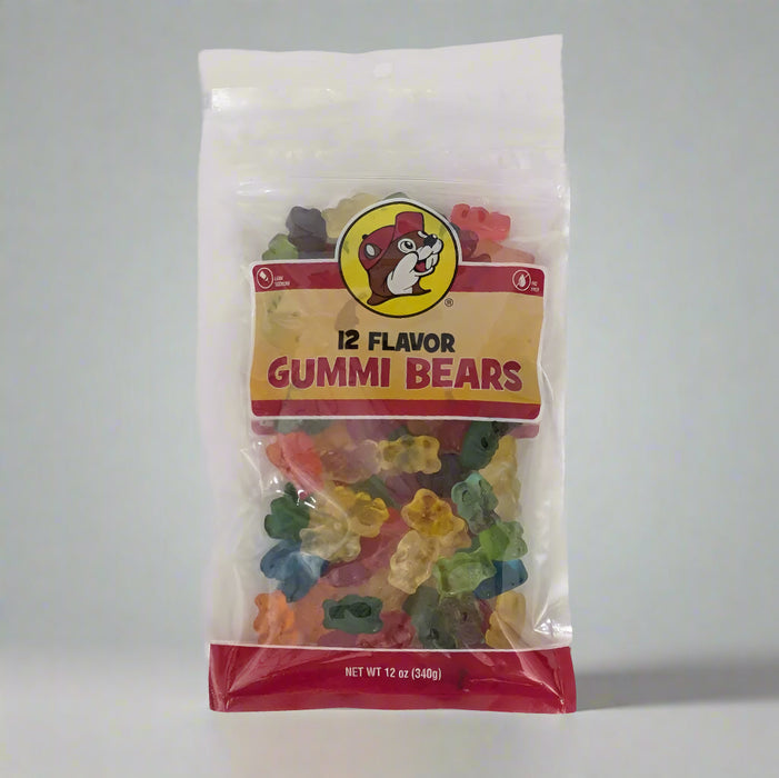 A clear plastic package of Buc-ee's 12 Flavor Gummi Bears with a red label showing the brand logo and the variety of gummy bears inside.