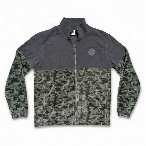 A front flat-view photo of a Buc-ee's men's full-zip fleece jacket on a white background. The jacket features a solid charcoal grey upper section, a dark camouflage lower body and sleeves, a round grey Buc-ee's beaver logo patch on the left chest, and side zippered pockets.