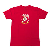 Front view of a vibrant red short-sleeve crew neck t-shirt laid flat on a white background, featuring a white highway shield logo on the chest enclosing a cartoon beaver mascot with the words "Buc-ee's Alabama."