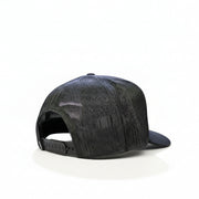 Back view of a gray Buc-ee’s trucker hat showing the mesh material and adjustable snapback closure, displayed on a white surface.
