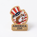Pin with American-themed design featuring a dog wearing a top hat with stars and stripes on a white background.