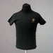 Front view of a black short sleeve Buc-ee’s t-shirt with a small bronze Buc-ee’s logo on the left chest.