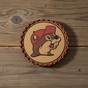 Buc-ee’s Beaver Metal Bottle Cap Coaster — featuring a cork center, bold red metal edge, and the famous Buc-ee’s beaver logo. Perfect for home bars and Buc-ee’s fans!