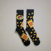 Buc-ee's Beaver Nugget Socks are black with beaver nuggets all over. 