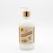 A square product shot of an 8 oz frosted glass pump bottle of Buc-ee's Beaver Nuggets Hand & Body Lotion, featuring a gold neck collar and a white pump nozzle pointing to the left, isolated against a seamless, solid white background.