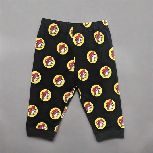 Buc-ee's Black Logo Kid Pants. Black with Buc-ee's logos all over it.