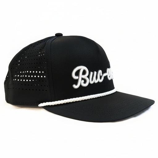 A side view of a Buc-ee’s black hat with white embroidered logo, rope brim detail, and breathable perforated panels, displayed on a clean white background.