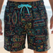 Colorful patterned shorts with a drawstring on a beach background