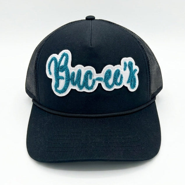 Buc-ee’s Black Trucker Hat with Teal Script Logo white background. 