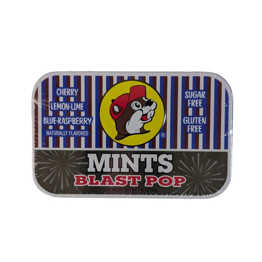 Front view of a rectangular Buc-ee's Blast Pop Mints metal tin on a white background. The top half features blue, white, and red stripes with a yellow circle displaying the Buc-ee's beaver mascot. The bottom half is dark grey with the words "MINTS BLAST POP" in bold white and red text.