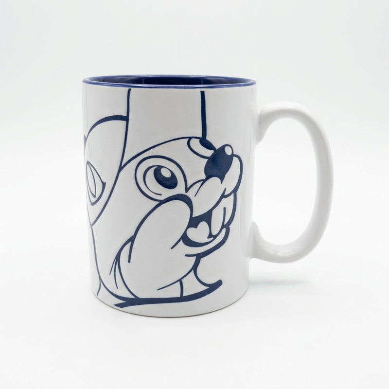 White ceramic mug with a blue interior and rim and blue line art of Buc-ee the Beaver's face